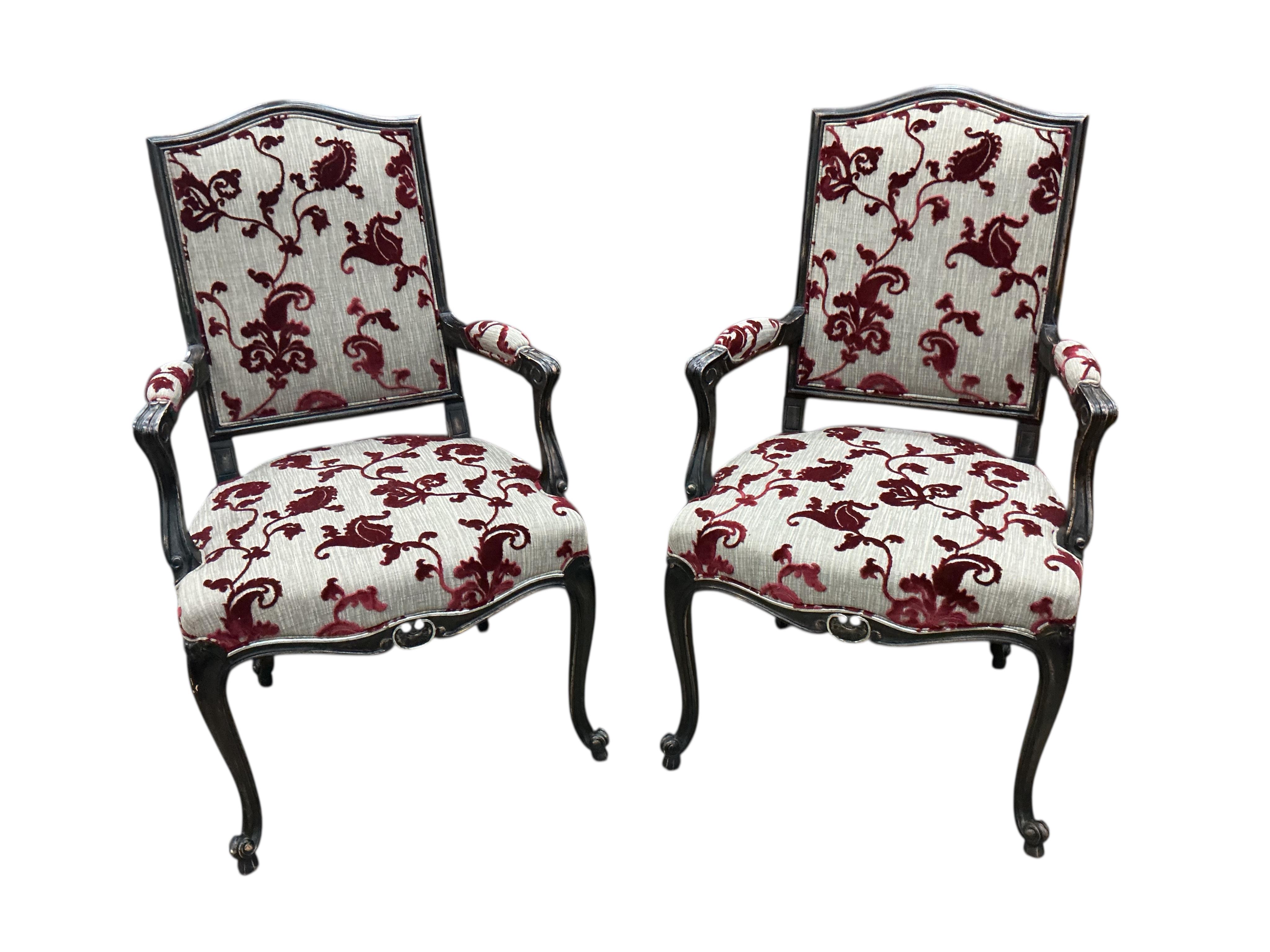 A set of eight Roche Bobois Louis XV style ebonised dining chairs, two with arms